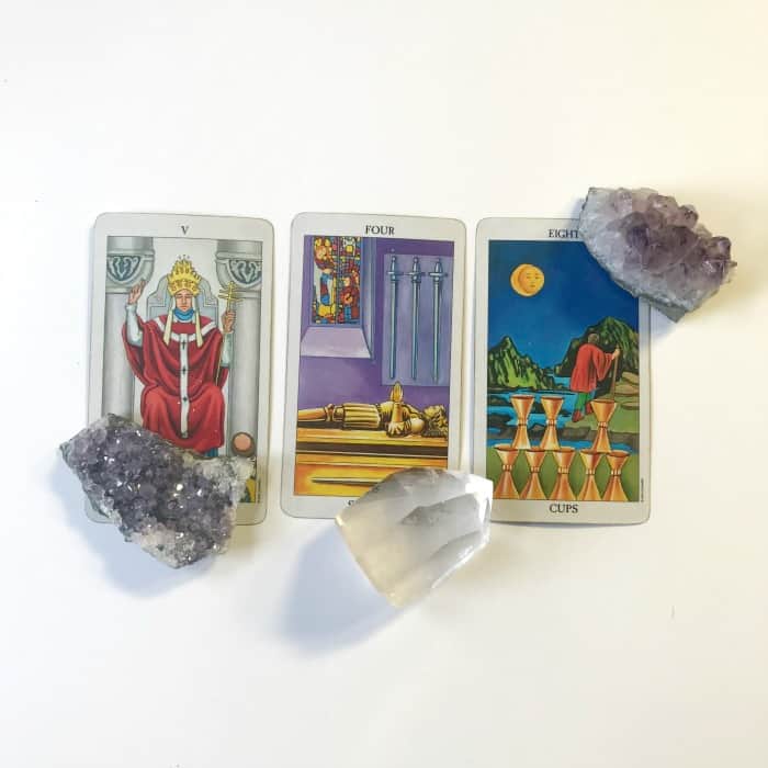 Tarot and Crystals and Rituals…oh my! A primer for working with Tarot and Crystals. Laying crystals on tarot cards